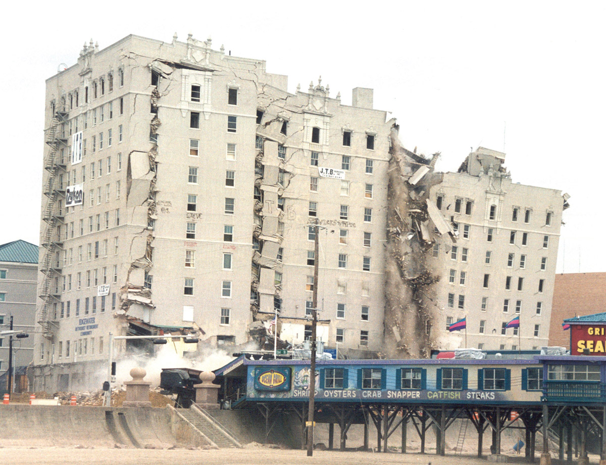 A photograph of the imploding Buccaneer Hotel, Galveston, Texas, 1 January 1999.