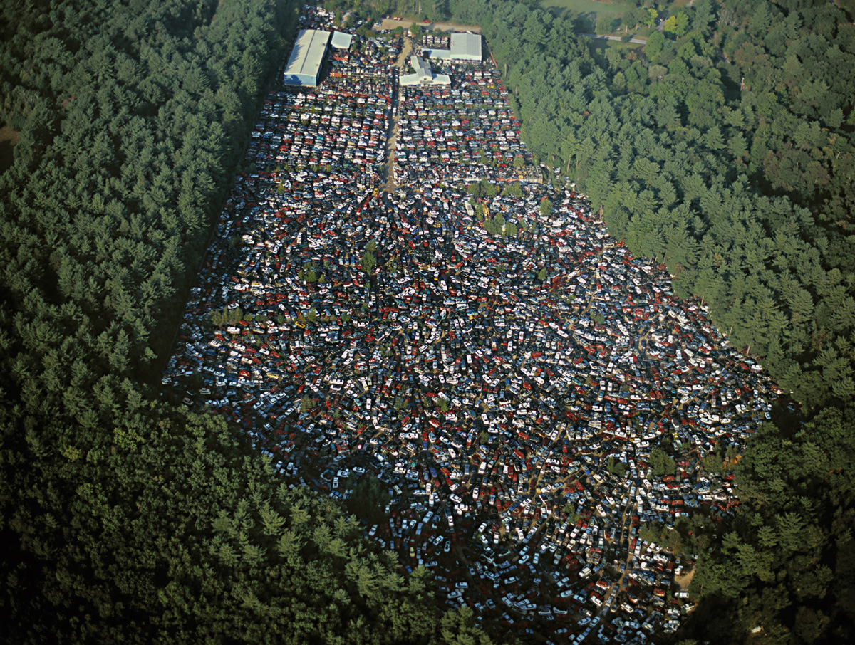 An aerial photograph of a car salvage and junkyard near Ayer, Massachusetts. In two thousand three, over twelve million automobiles were scrapped or junked in the US.