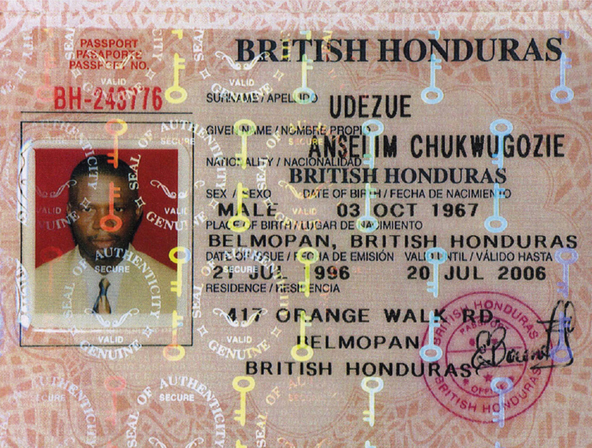 A photograph of a passport used by Anselim Udezue to successfully apply in nineteen ninety eight for tourist visas for Austria, Germany, and Switzerland; he subsequently toured the countries for nine months. It was not until his departure that a Swiss airport official noticed that “British Honduras,” the state that had allegedly issued the passport, does not exist.