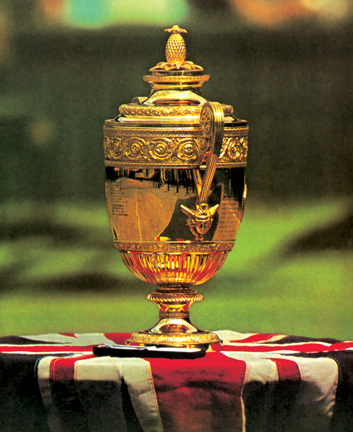 A photograph of the Wimbledon Challenge Cup, awarded to the men’s singles champion, which bears a pineapple at its apex.
