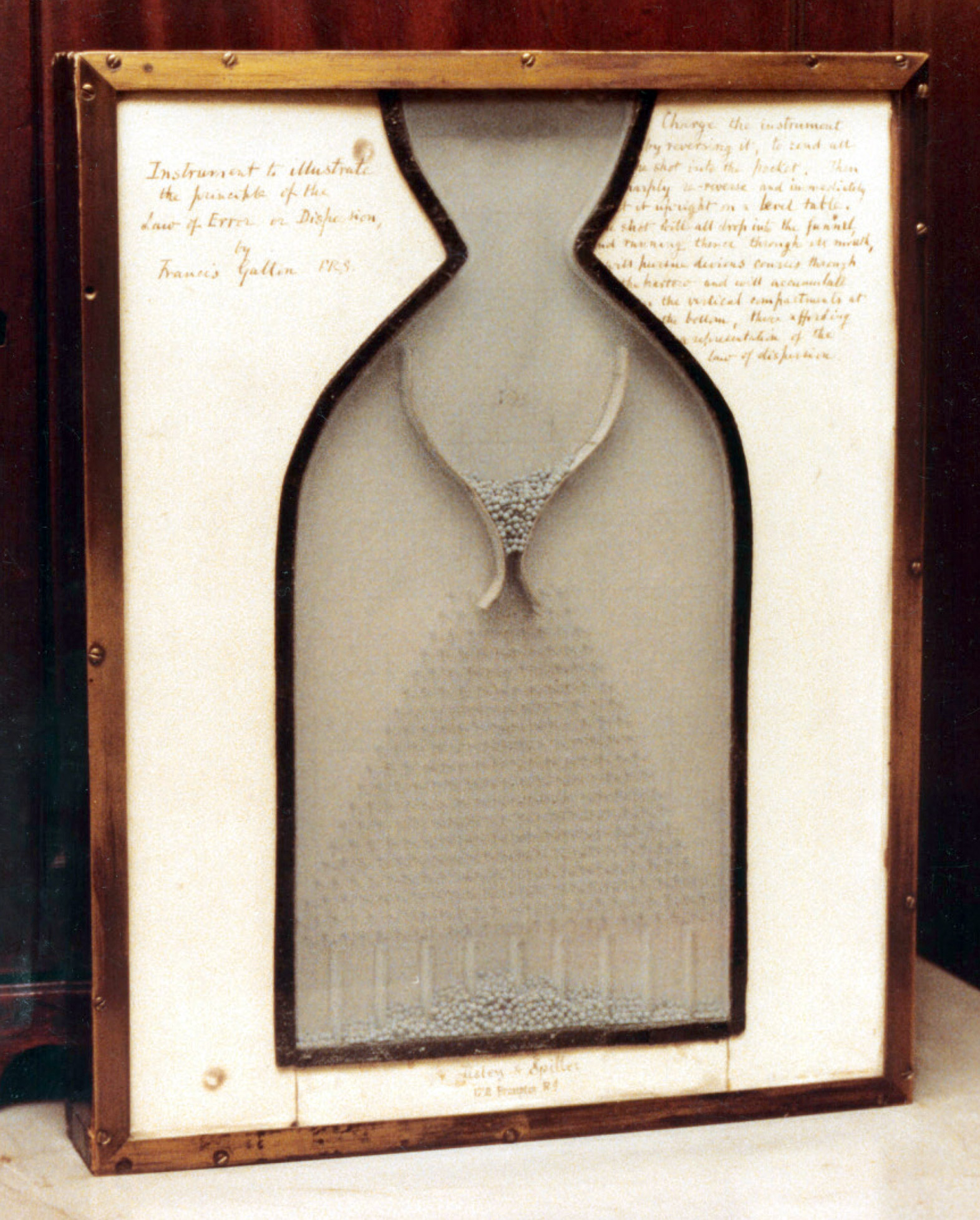 A photograph of a Galton Board on display at the Galton Laboratory, University College London. 