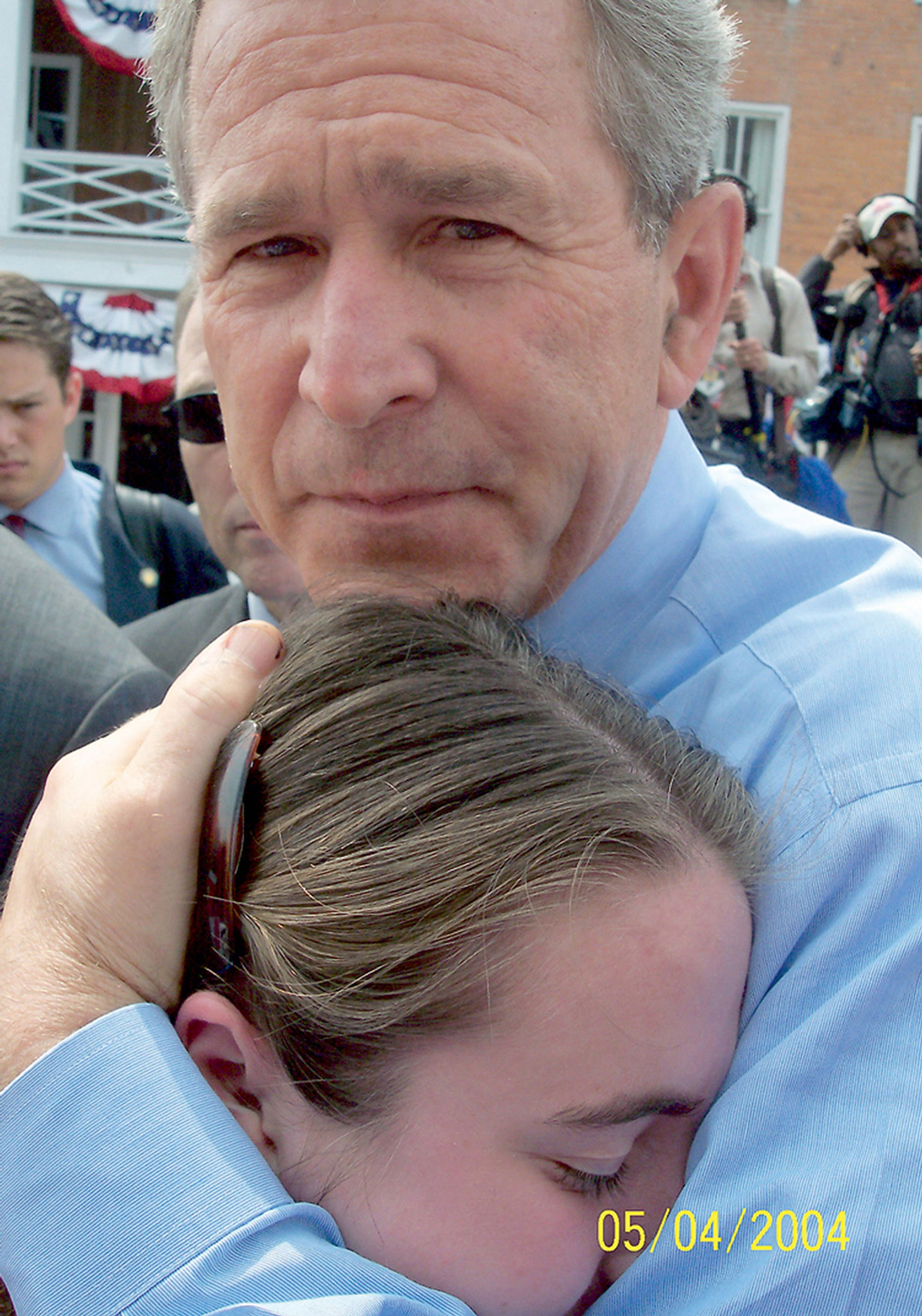 A 2004 photograph of George W. Bush hugging Ashley Faulkner. 