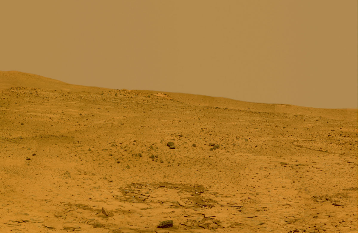 A 2008 photograph taken by the Mars Exploration Rover “Spirit” which shows the characteristic “butterscotch” color of the Martian sky due to atmospheric dust containing magnetite.