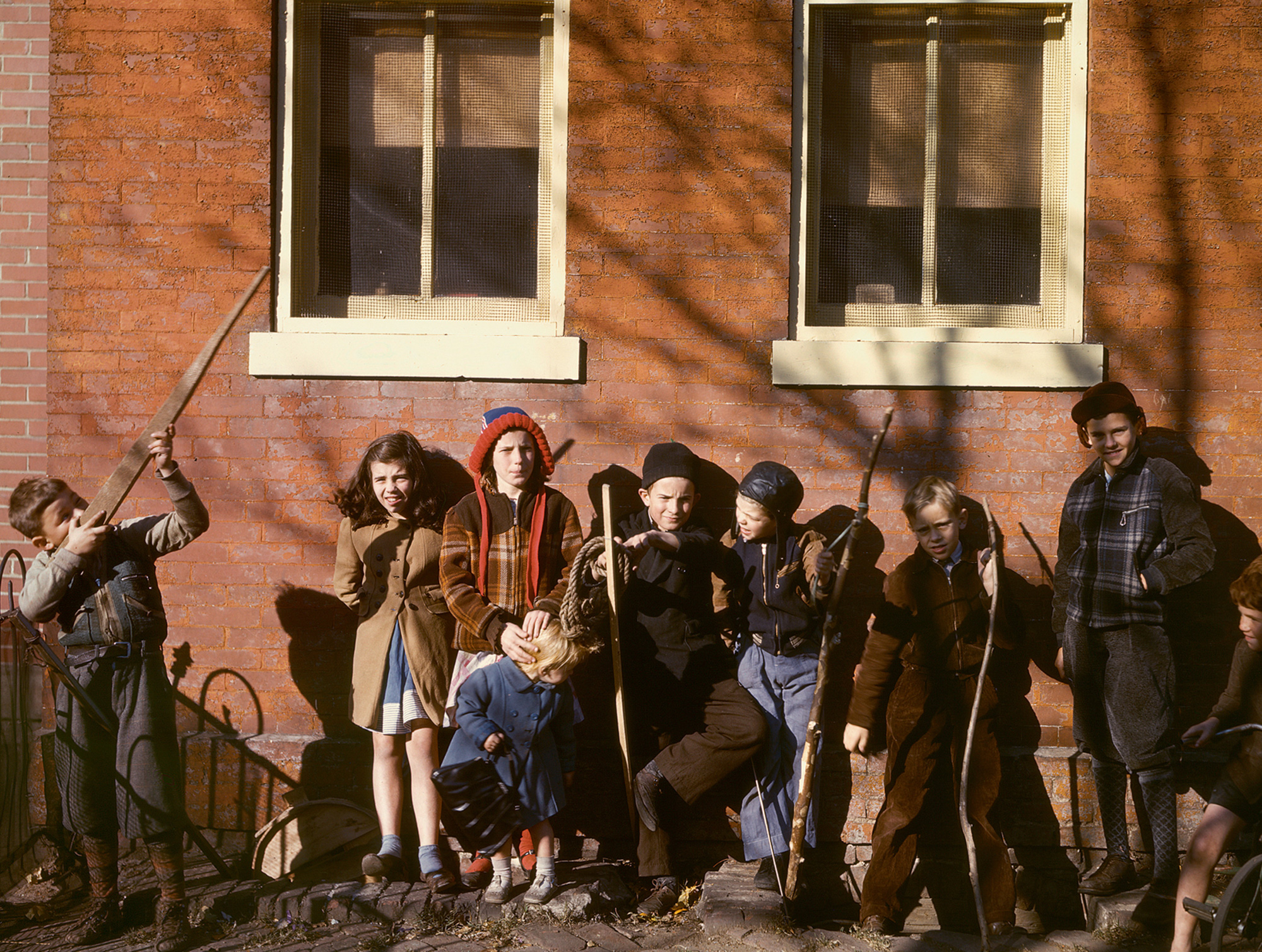A circa 1941 photograph of children standing outside a school in Washington, DC. 