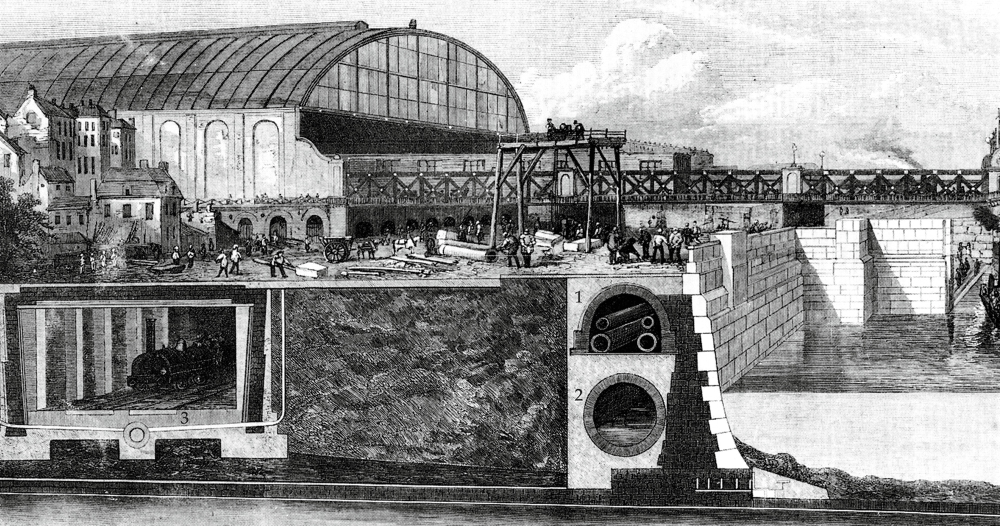 A diagram from the Illustrated London News, 22nd of June eighteen sixty-seven, depicting a section view of the Thames Embankment and London’s underground infrastructure. The illustration highlights the tunnel for the Metropolitan District Railway, Joseph Bazalgette’s sewer system, and a horizontal shaftway built to house gas and water pipes. 
