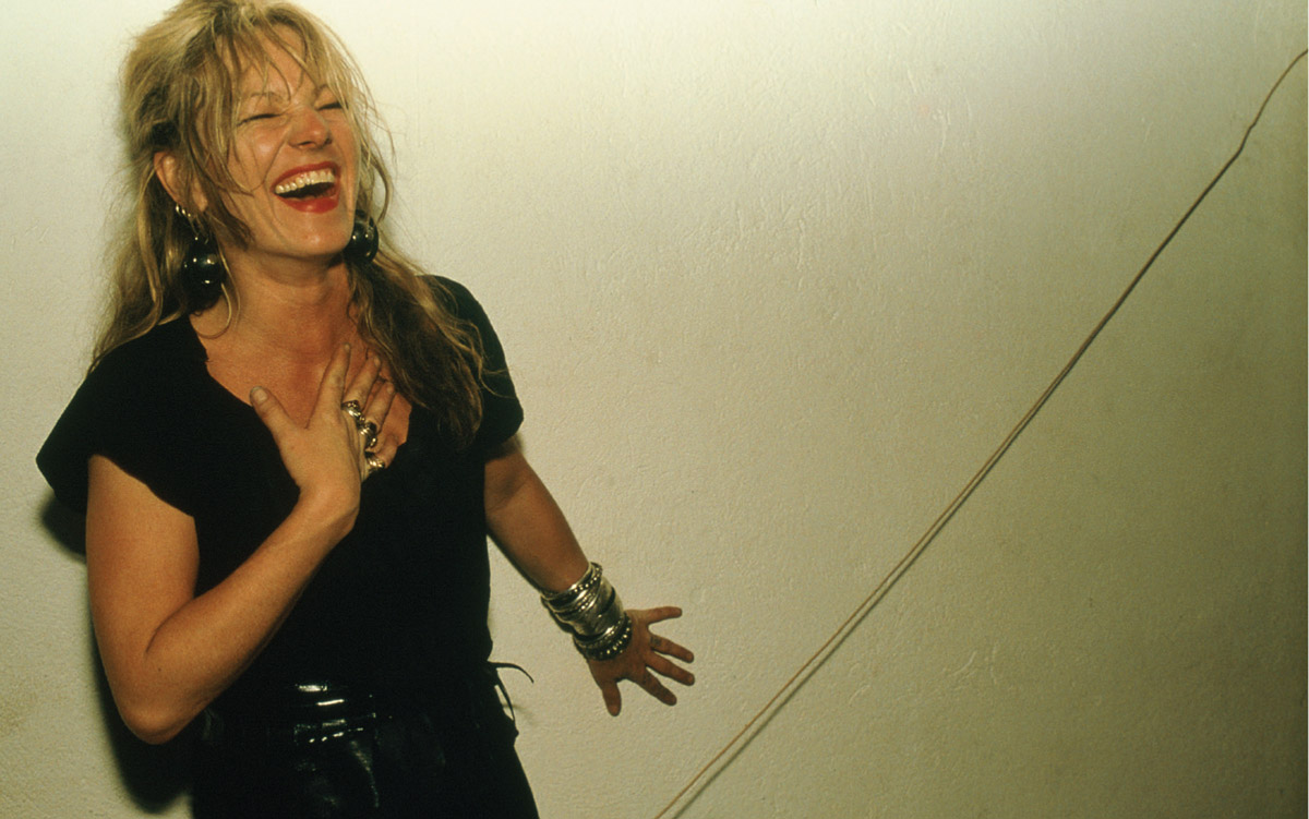 A nineteen eighty five photograph by Nan Goldin titled “Cookie laughing, NYC.”