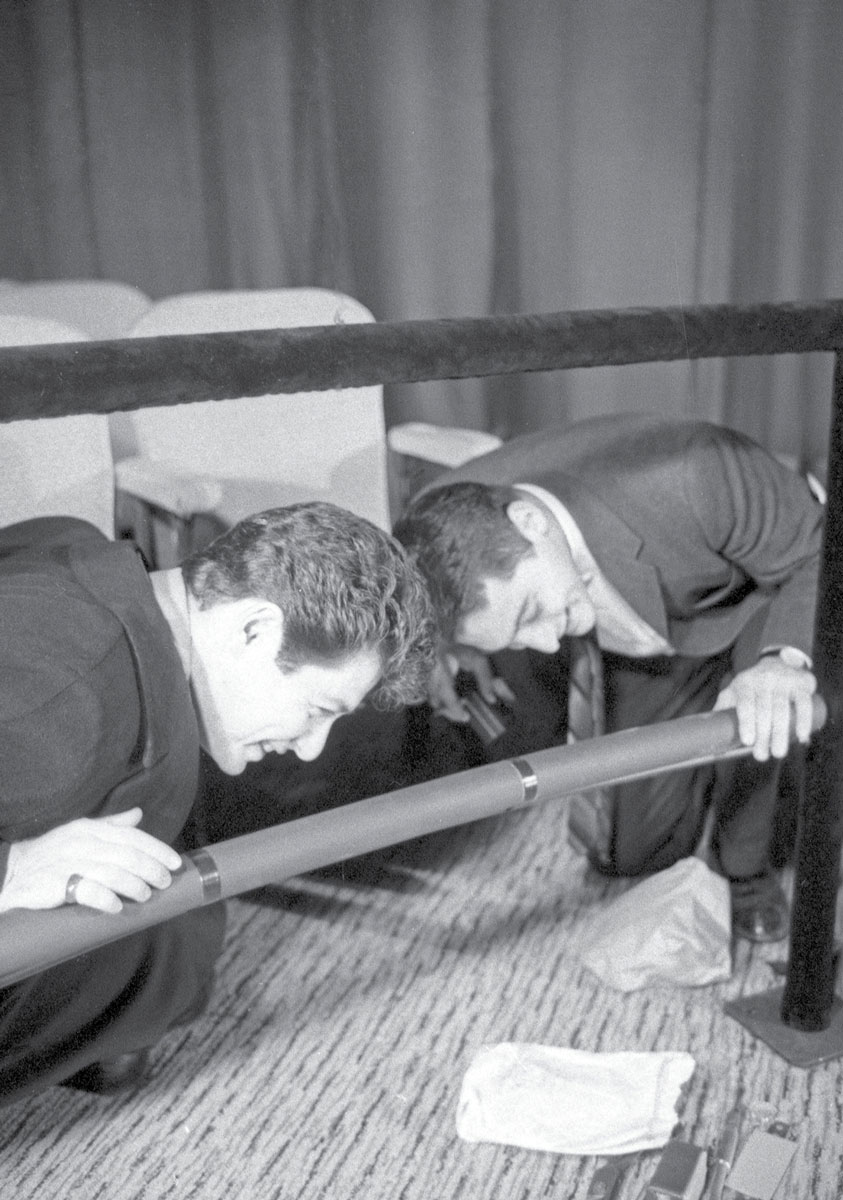 A photograph of Mike Todd Junior and singer Eddie Fisher, then-husband of “Scent of Mystery” heroine Elizabeth Taylor, inspecting olfactory plumbing at Cinestage.