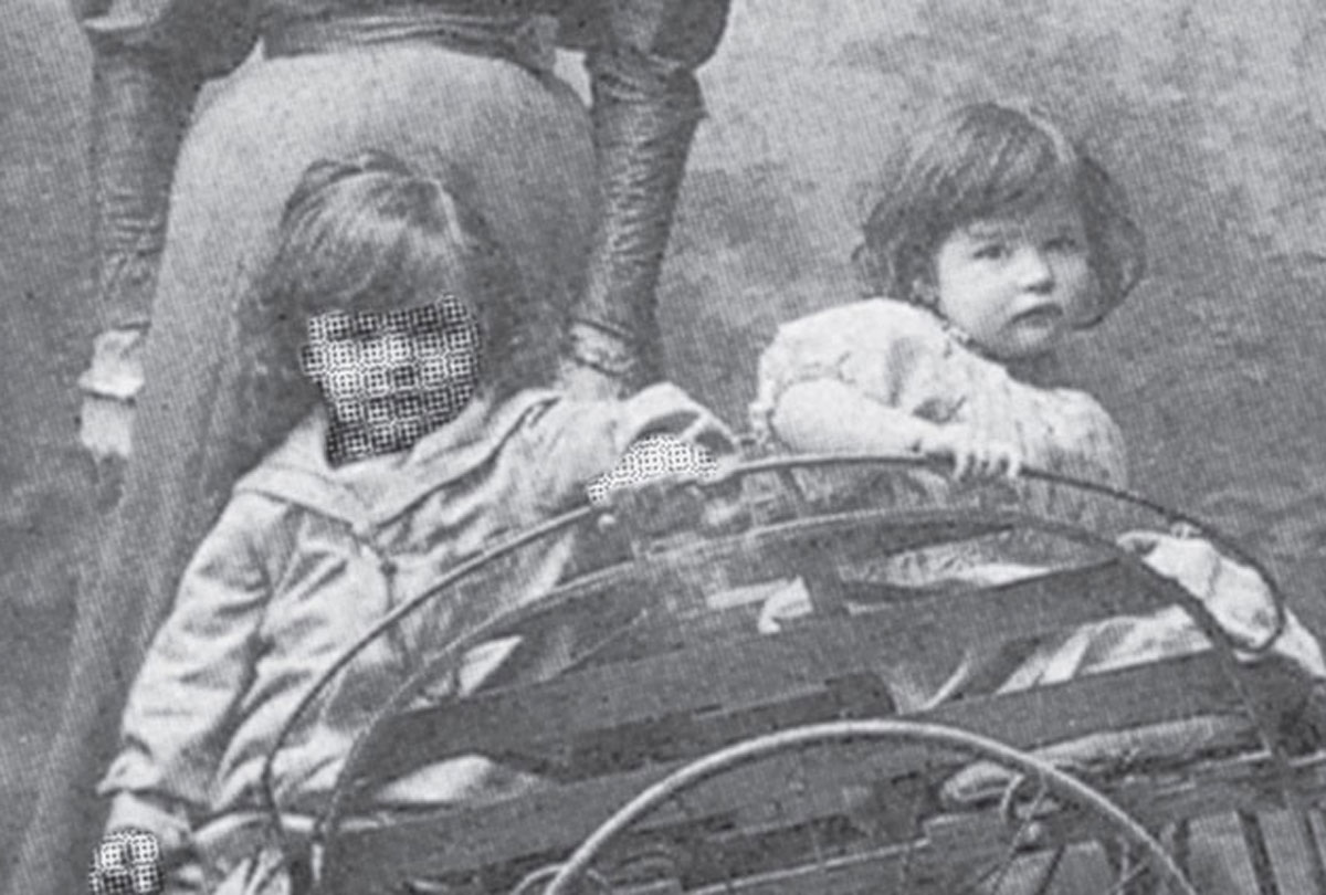 A photograph of two children, one of whom is Ernst Moiré. Moiré's face mysteriously bears the very pattern that came to be named after him.