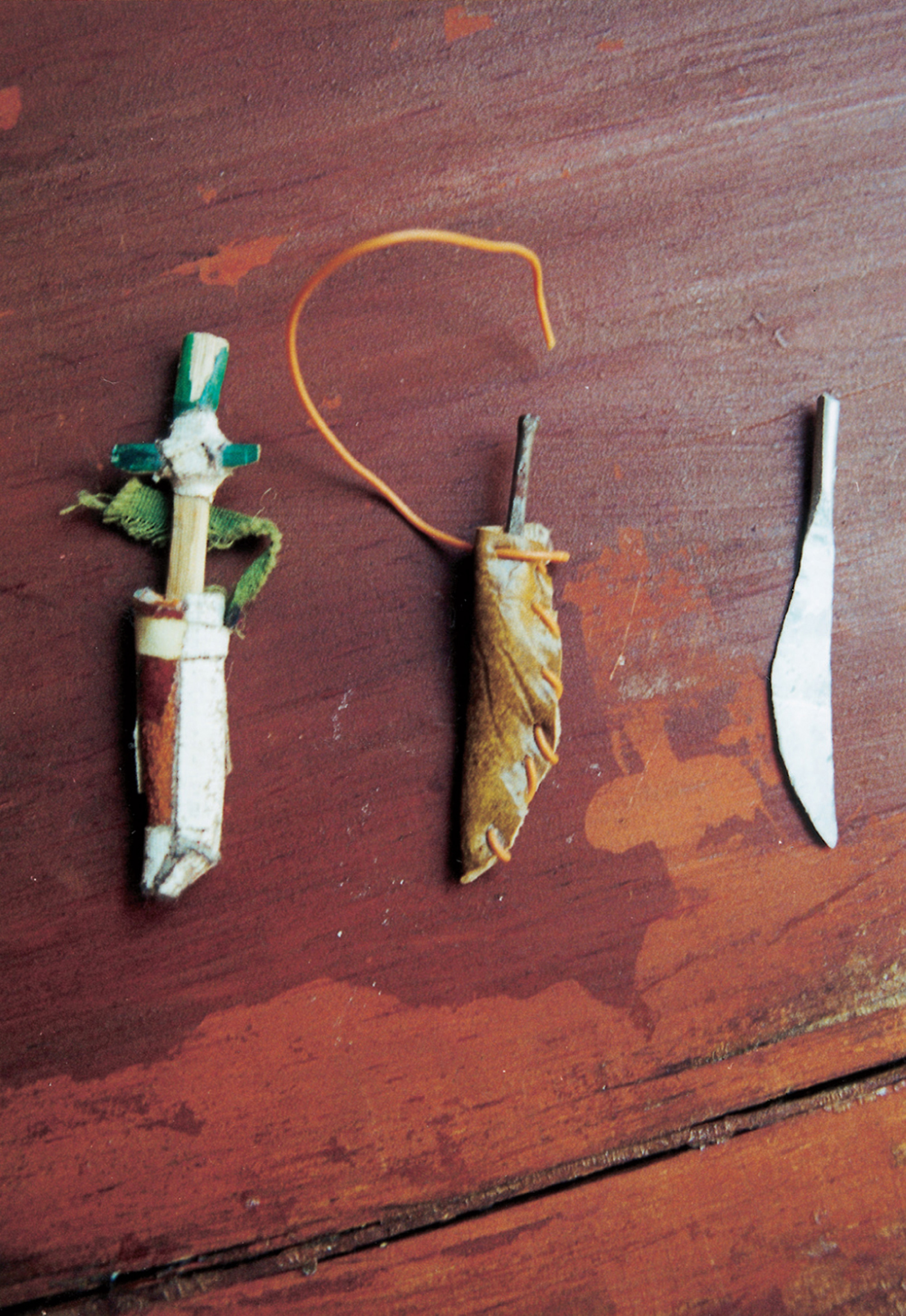 A photograph depicting three tiny knives. The caption reads: Lot of three daggers. 1. Steel dagger made of a round-headed nail, half of which has been hammered flat to make a straight, narrow blade; the sheath is faux leather, folded and stitched up one side with telephone wire, the end of which is left loose to serve as a strap.
2. Aluminum dagger made of a length of wire hammered flat.
3. Bamboo dagger, whittled flat and tapered toward the tip. The grip is colored green on one side; a short hand-guard is affixed to the blade with white medical cloth tape. The blade fits snugly inside its sheath, which is real leather folded and joined with more cloth tape. A thin strip of fraying green cloth is taped to the top of the sheath; this once formed a loop for hanging, but is torn close to the sheath on one end.
Daggers, not all of them as finely crafted as these, were de rigueur for the heroes and heroines (above all the spunky Aina) of the Doll Games’ “Pirate” and “Outlaw” scenarios.
 
 
 	
A photograph depicting three tiny knives. The caption reads: Lot of three daggers. 1. Steel dagger made of a round-headed nail, half of which has been hammered flat to make a straight, narrow blade; the sheath is faux leather, folded and stitched up one side with telephone wire, the end of which is left loose to serve as a strap.
2. Aluminum dagger made of a length of wire hammered flat.
3. Bamboo dagger, whittled flat and tapered toward the tip. The grip is colored green on one side; a short hand-guard is affixed to the blade with white medical cloth tape. The blade fits snugly inside its sheath, which is real leather folded and joined with more cloth tape. A thin strip of fraying green cloth is taped to the top of the sheath; this once formed a loop for hanging, but is torn close to the sheath on one end.
Daggers, not all of them as finely crafted as these, were de rigueur for the heroes and heroines (above all the spunky Aina) of the Doll Games’ “Pirate” and “Outlaw” scenarios.
Turn on screen reader support
To enable screen reader support, press ⌘+Option+Z To learn about keyboard shortcuts, press ⌘slash

