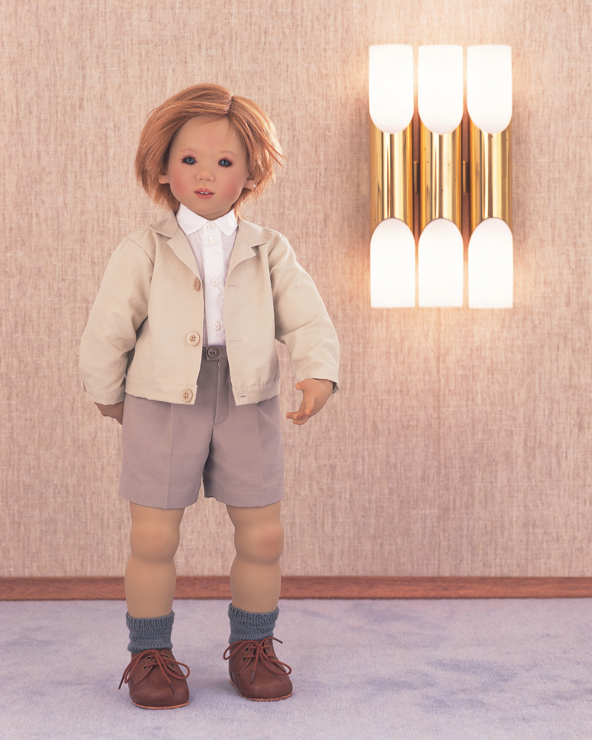 A photograph of a doll designed by Annette Himstedt depicting Emil, a boy from Germany.