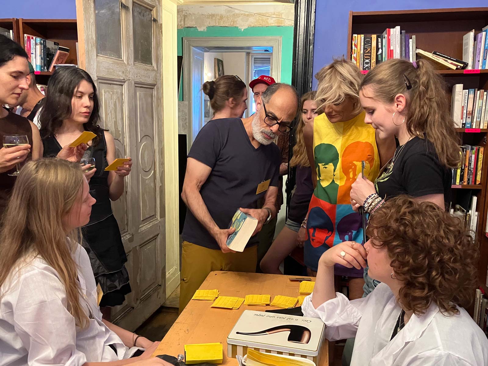 People examining a Tom Stoppard book brought to the Berlin event.