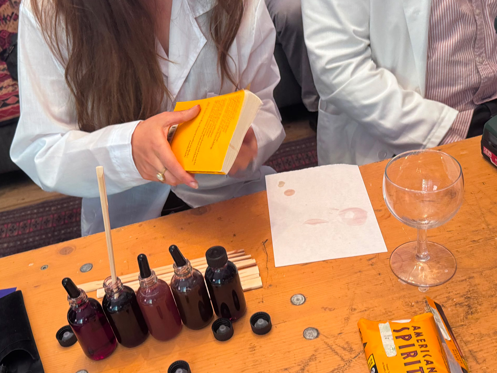 The agency’s “Fluid Dynamics Specialist” adding splashes of wine to a book.