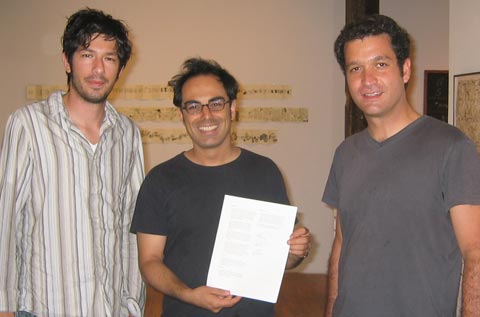 Artist, patron and producer shown with signed contract. From left: Mario Garcia Torres (Artist), Sina Najafi (Patron / Editor-in-chief), and Luis Miguel Suro (Producer)