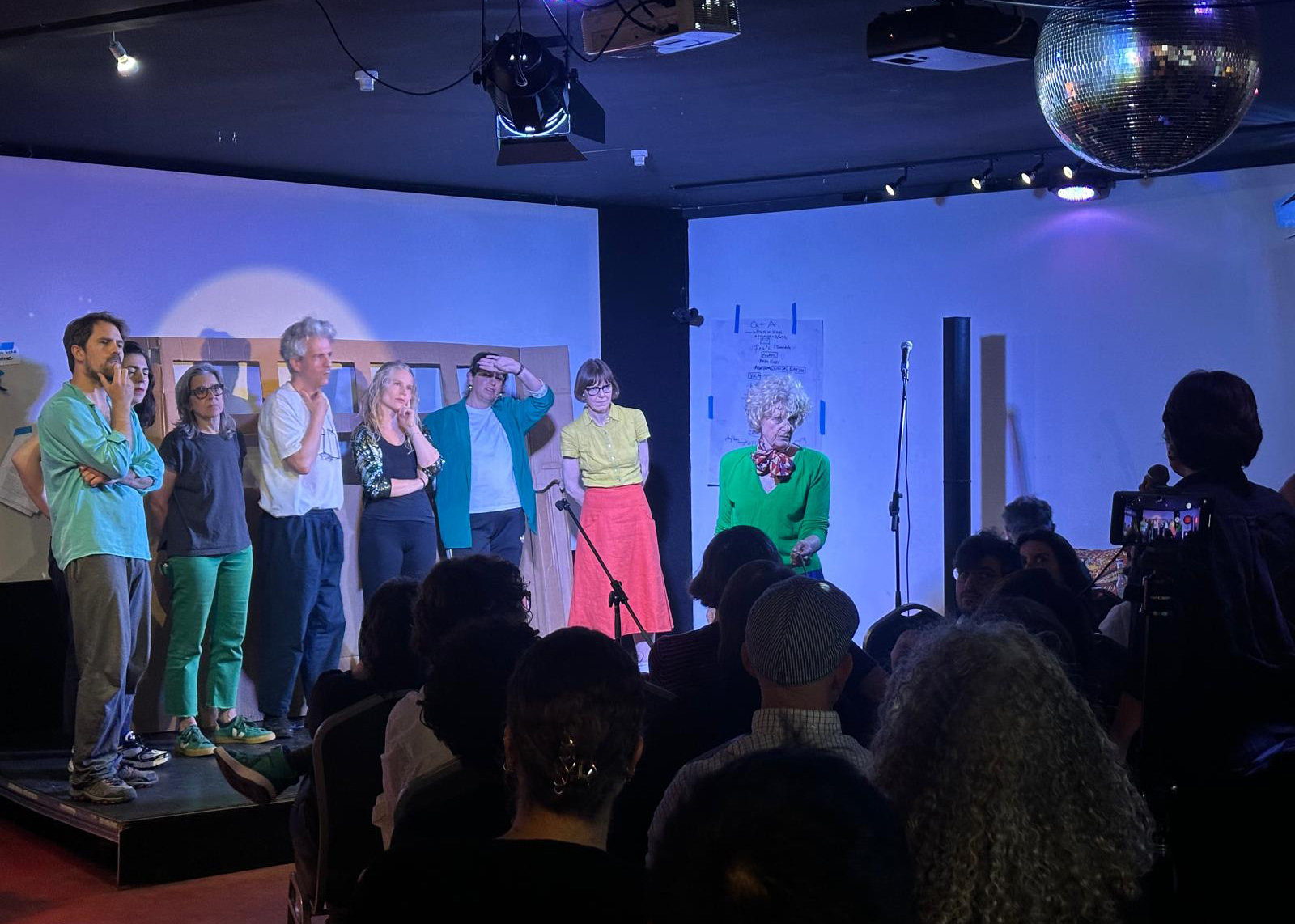 A photograph of the show’s opening act, when the performers gathered on stage to conduct a mock interview and question and answer session with the audience.