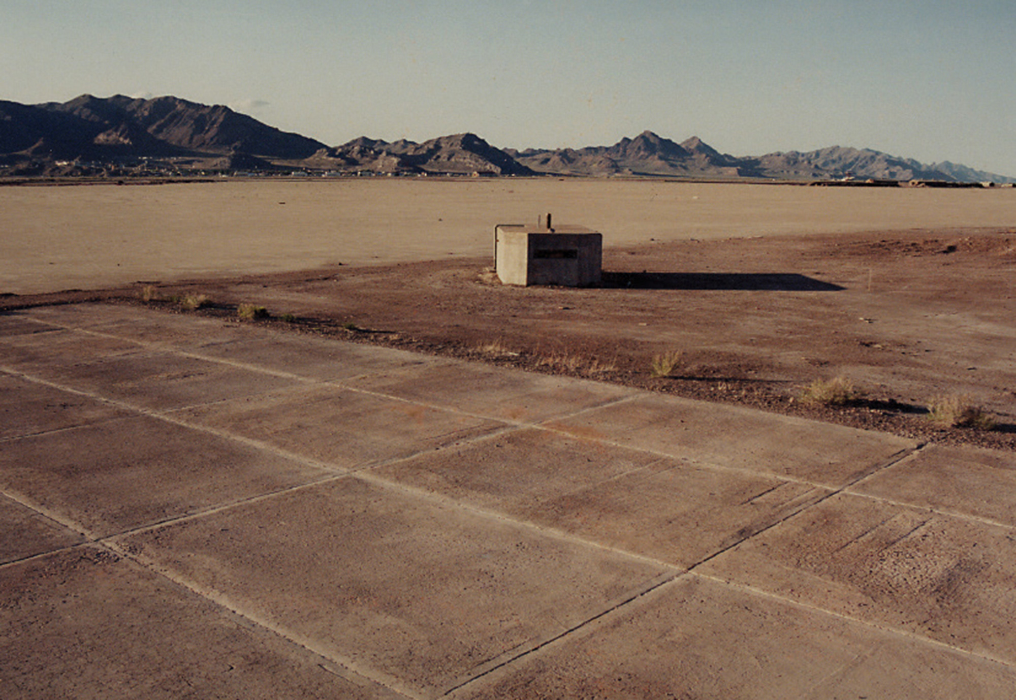 A photograph of a launch pad bunker in a desolate landscape.