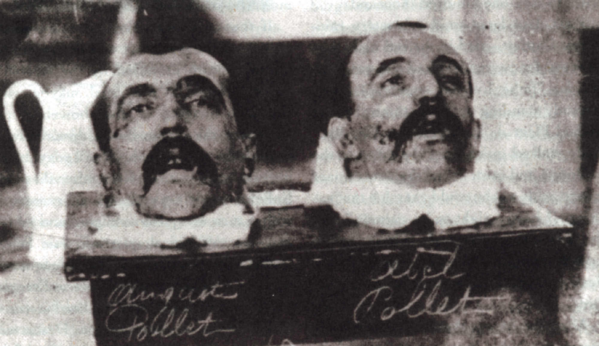 A photograph of the severed heads of twin brothers and convicted armed robbers Auguste and Abel Pollet, guillotined on 11 January 1909.