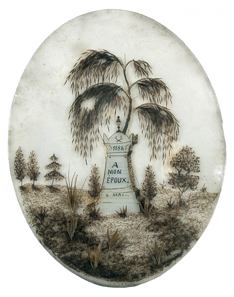 A photograph of a French Memento mori from the nineteenth century, made out of hair. 
