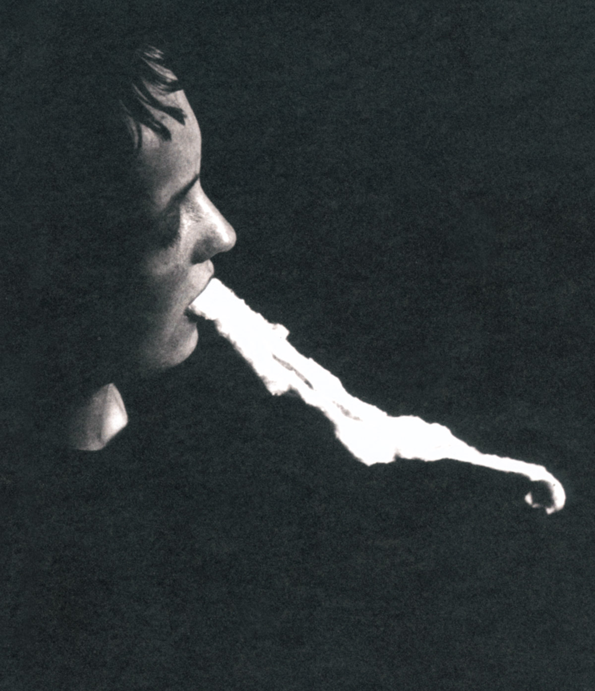 A photograph of Stanislawa P. during the séance of 25 January 1913, ectoplasm streaming from her mouth.