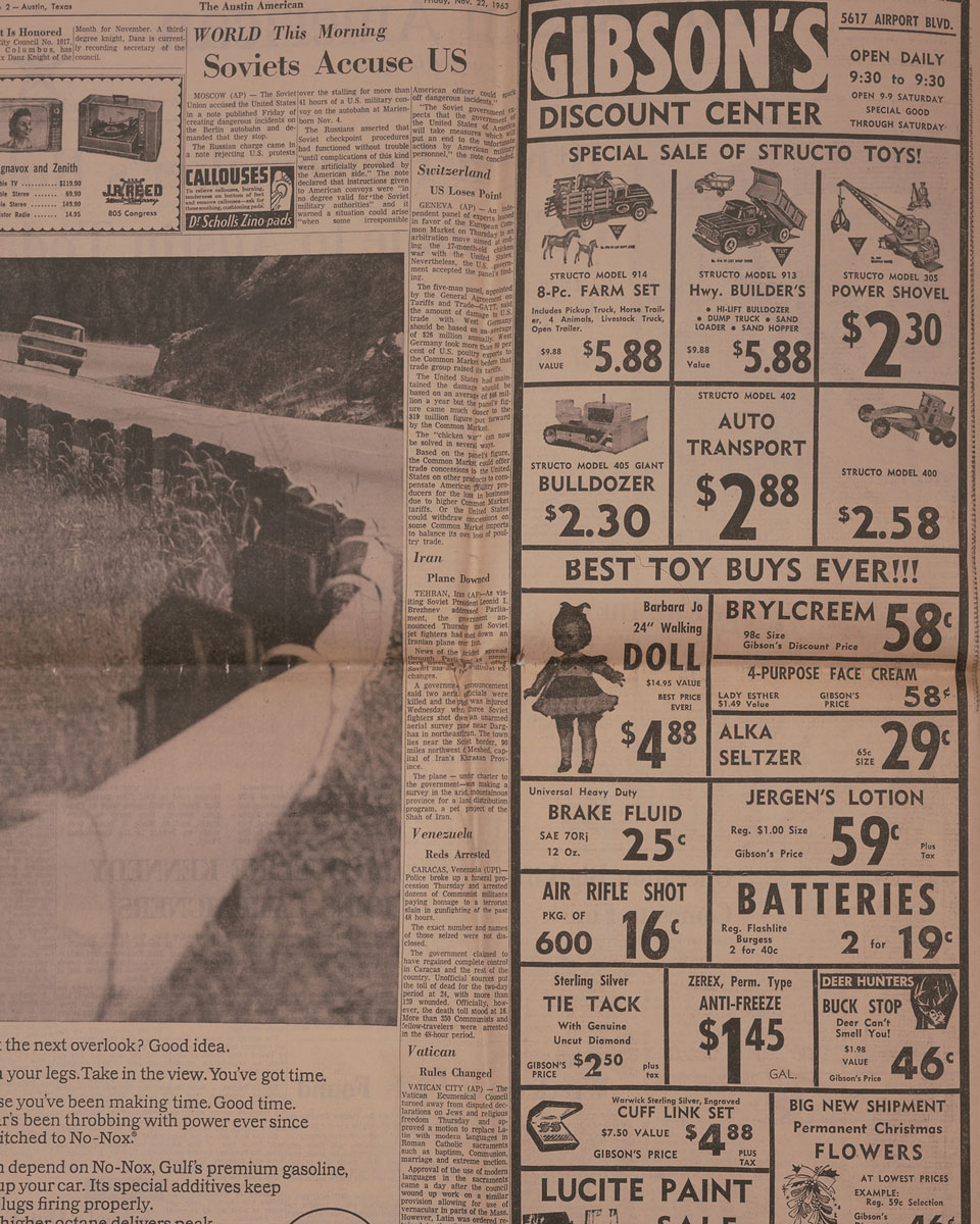 Ads on the back of the newspaper, including for an air soft rifle.