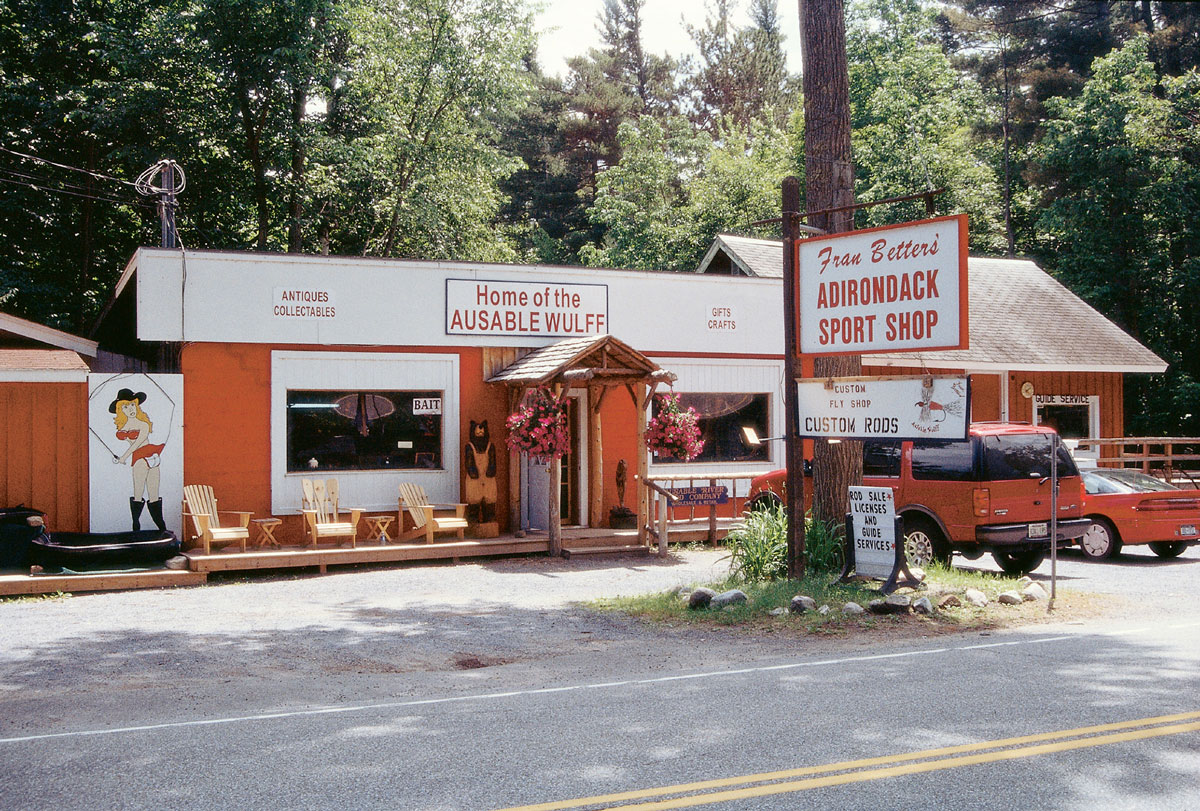 A photograph of the low, orange building of Fran Betters’s Adirondack Sport Shop.