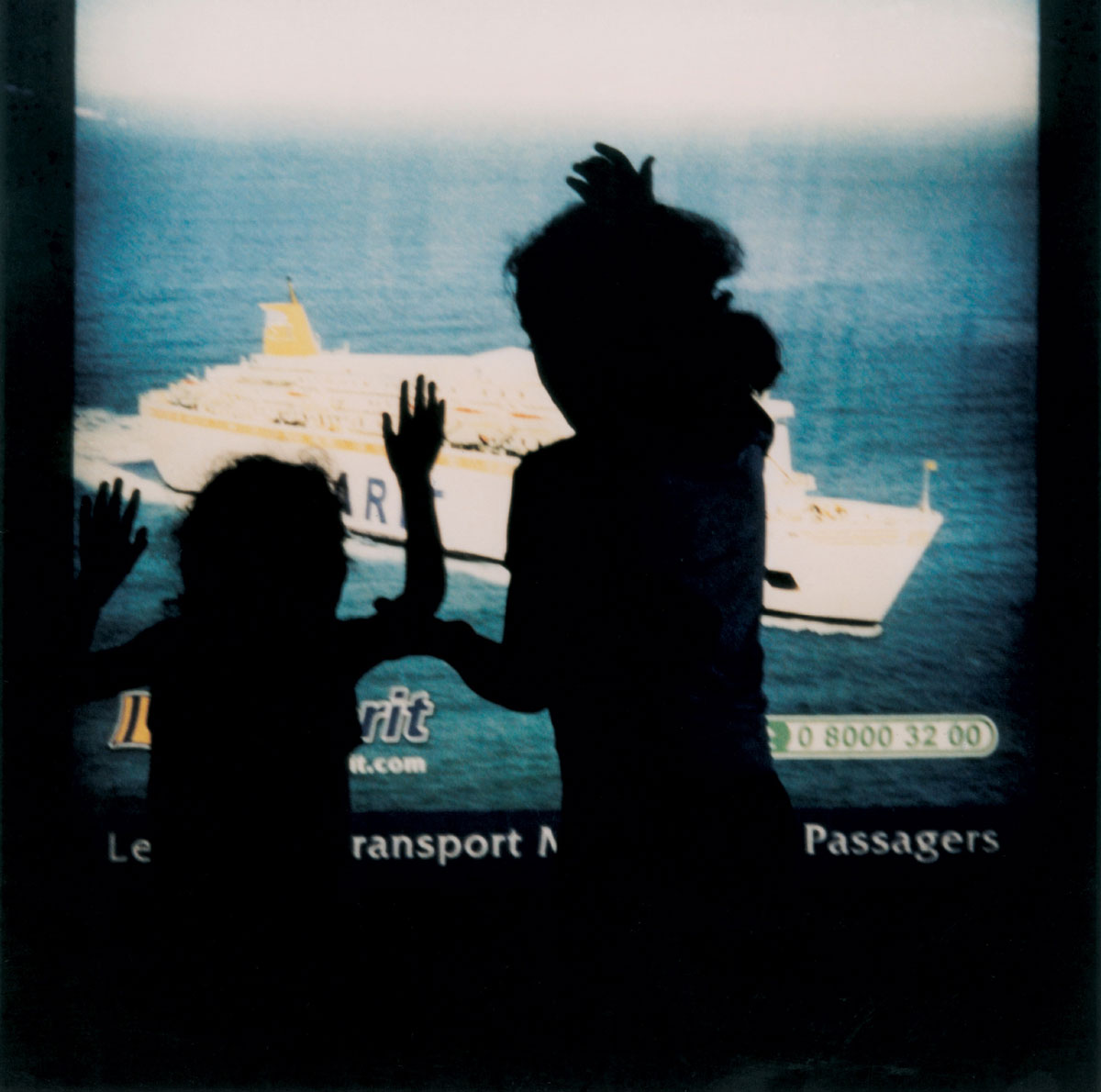 Artist Yto Barrada's 2003 photograph of children in Tangier playing in front of a backlit advertisement titled 