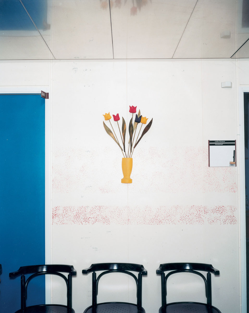 Artist Lars Tunbjörk’s 2002 photograph titled “Waiting Room, The Social Welfare Committee’s Office, Botkyrka, Sweden.”