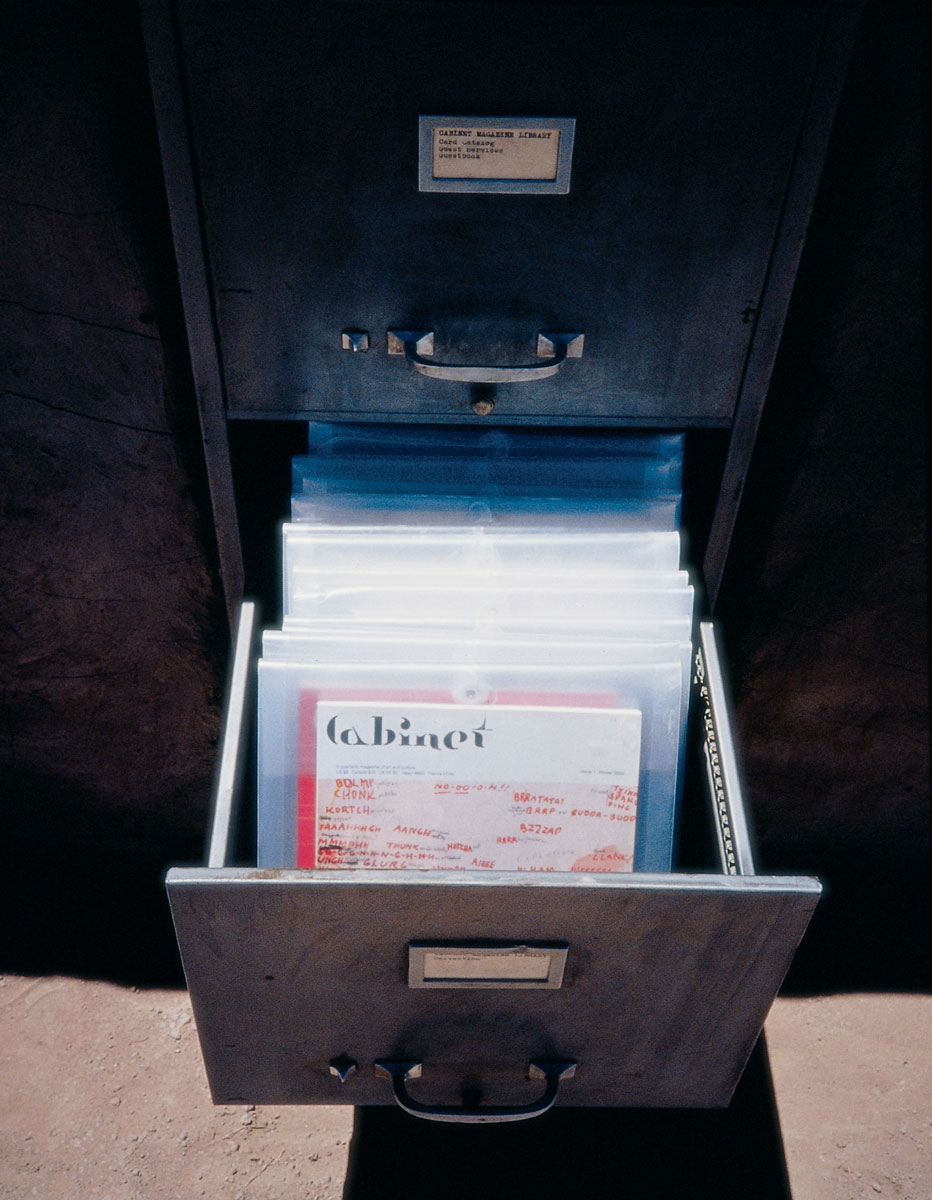 A photograph of the open filing cabinet containing issues of Cabinet Magazine.