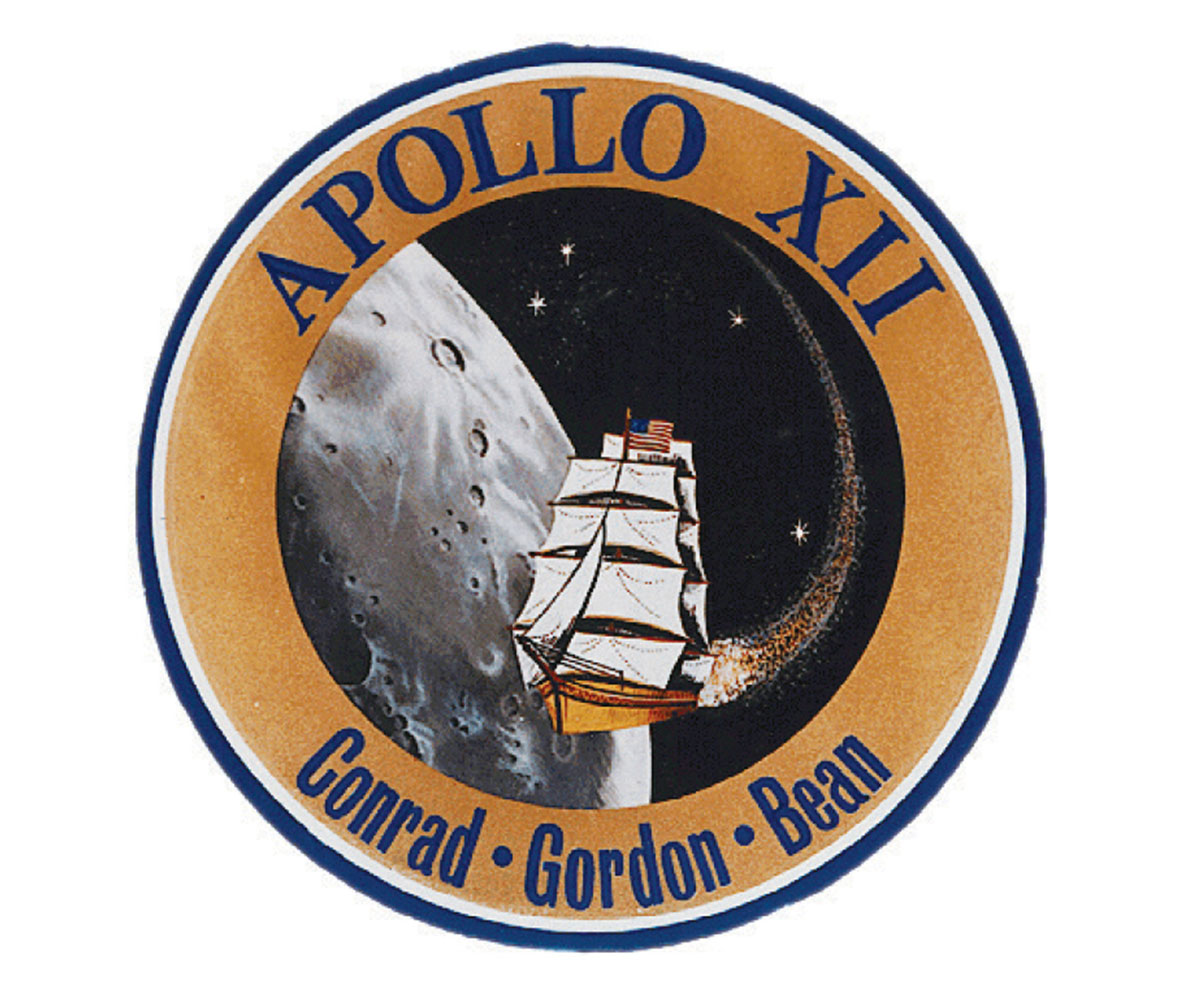 A circular badge featuring the NASA Apollo 12 logo, which depicts a ship sailing to the moon.