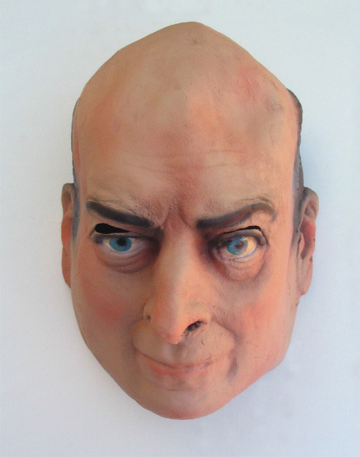 A photograph of a mask of Domingo Cavallo, Minister of Economy in Argentina from 1991 to 1996. 