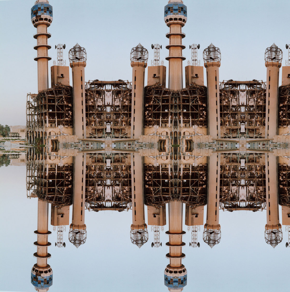A 2004 artwork by Caitlin Masley titled “two towers,” depicting a photograph of buildings digitally rendered to create symmetrical geometric patterns.