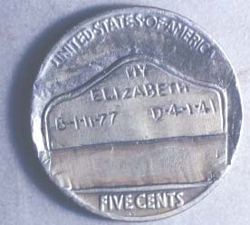 Nickel engraved with a tombstone and the text “My Elizabeth. B 1-11-77, D 4-1-41.”