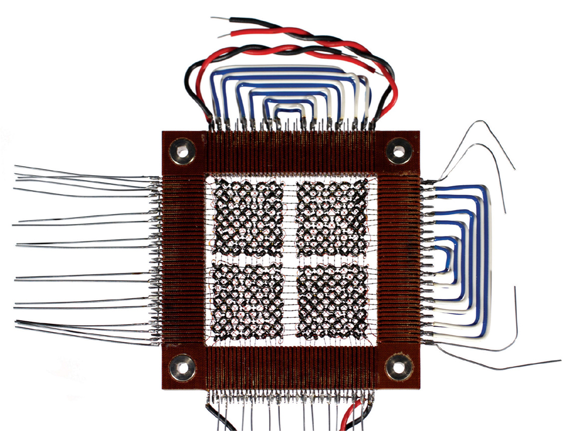 A photograph of a twenty-four by twenty-four-bit core memory plane. Core diameter two point zero millimeters. Manufacturer and date unknown.