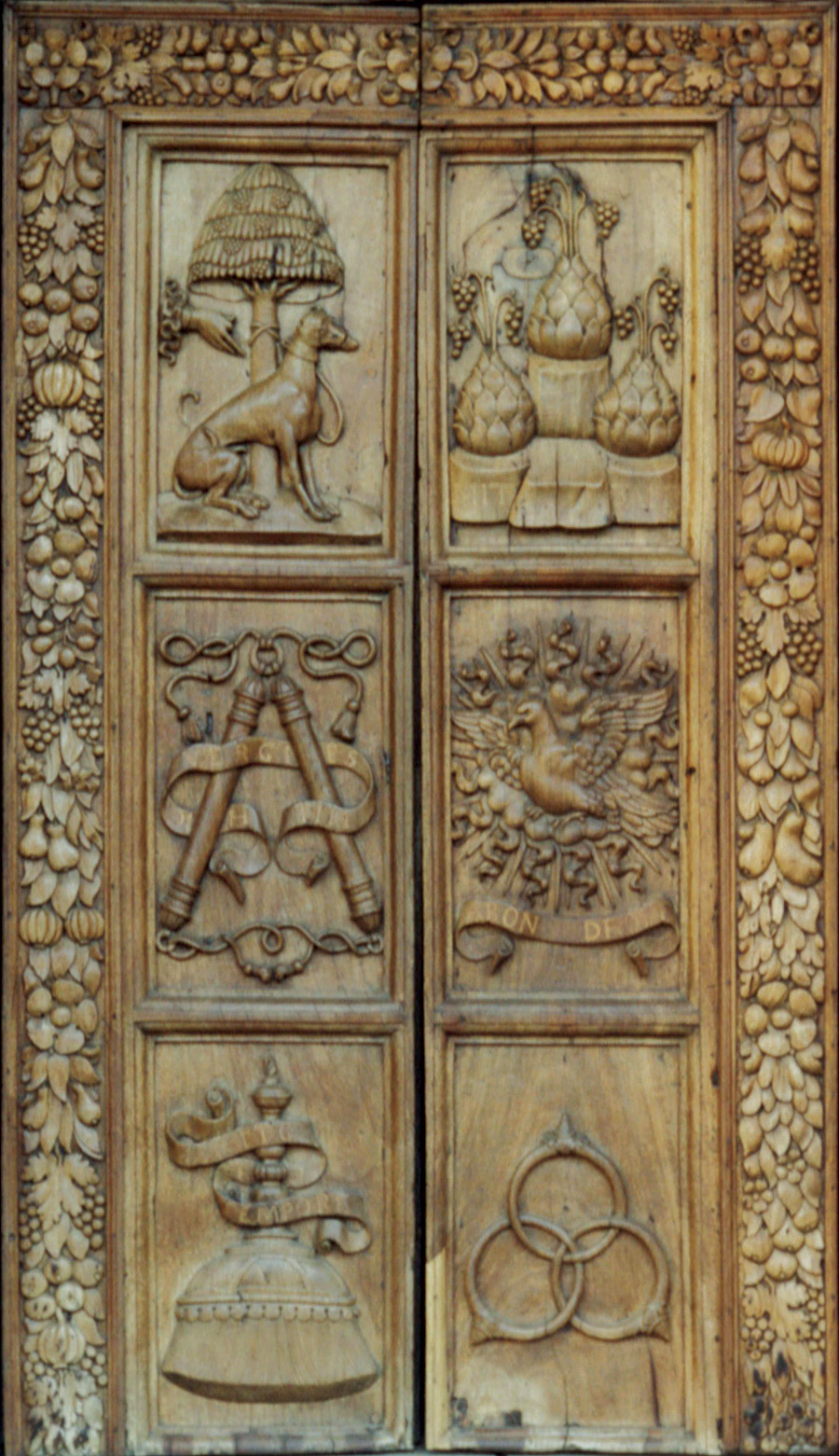 A photograph of the door of the Church of San Sigismondo in Cremona, where Bianca Maria Visconti and Francesco Sforza were married in fourteen forty one. Sforza’s family emblems, including the Borromean rings, are carved on the door.