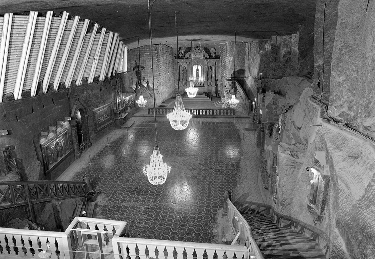 A photograph of the Blessed Kinga chapel in the Wieliczka mine, located 101 meters under the surface of the earth. This chapel was entirely forged in salt: walls, ceiling, floor, sculptures, and even chandeliers are made of crystal salt.