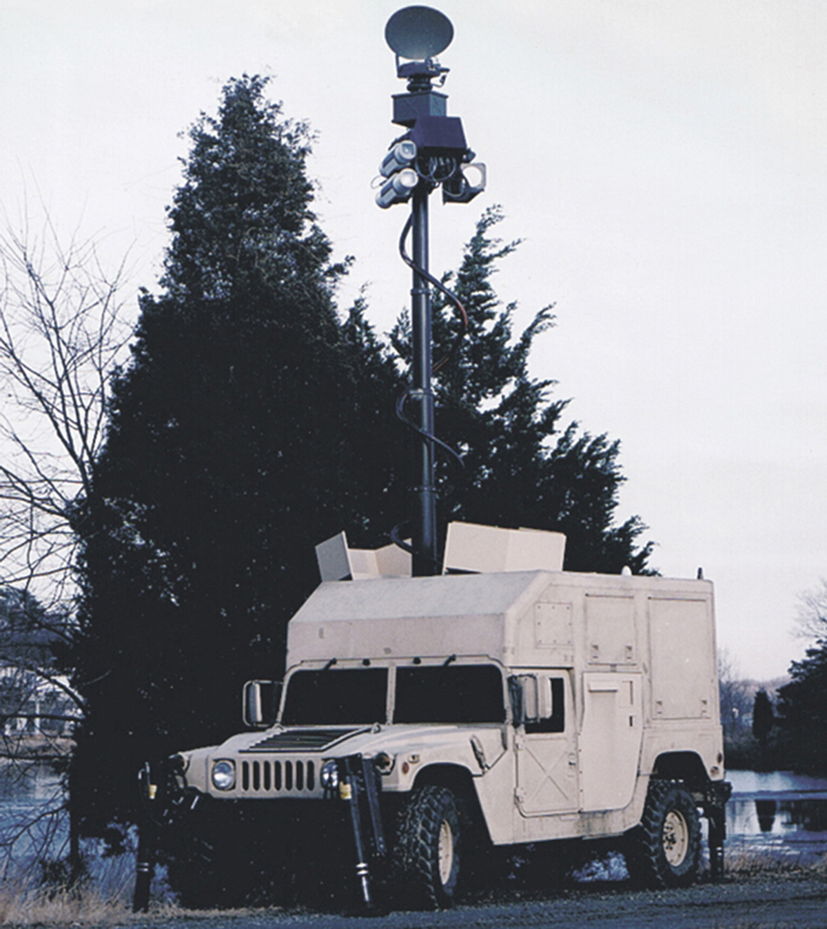 A photograph of a Magic Warrior/Nightstalker Humvee, imaging system deployed. 