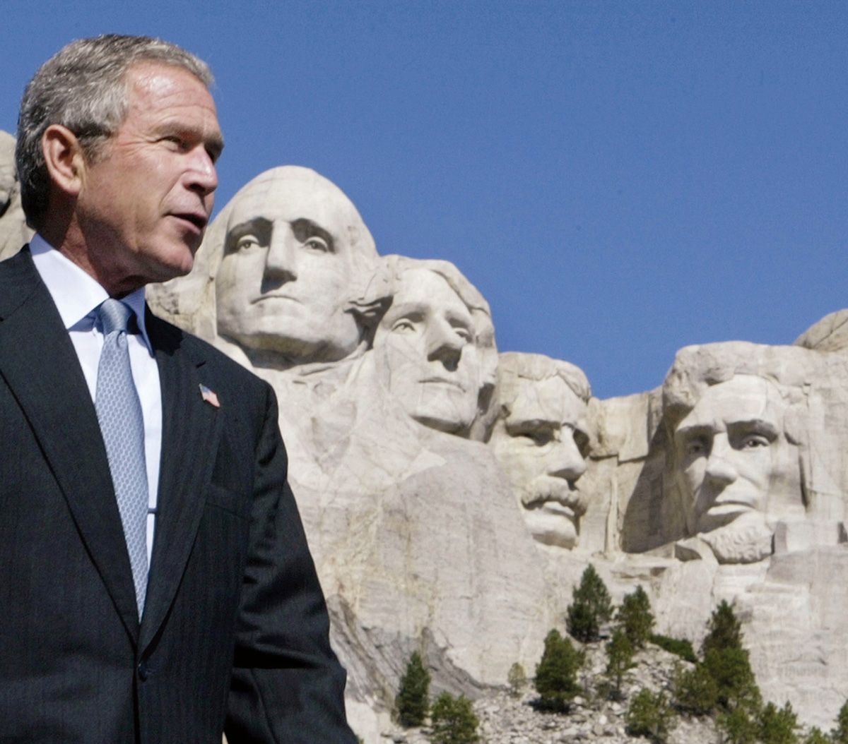 George W. Bush trying out for Mount Rushmore, 15 August 2002.
Photo Reuters/Larry Downing.