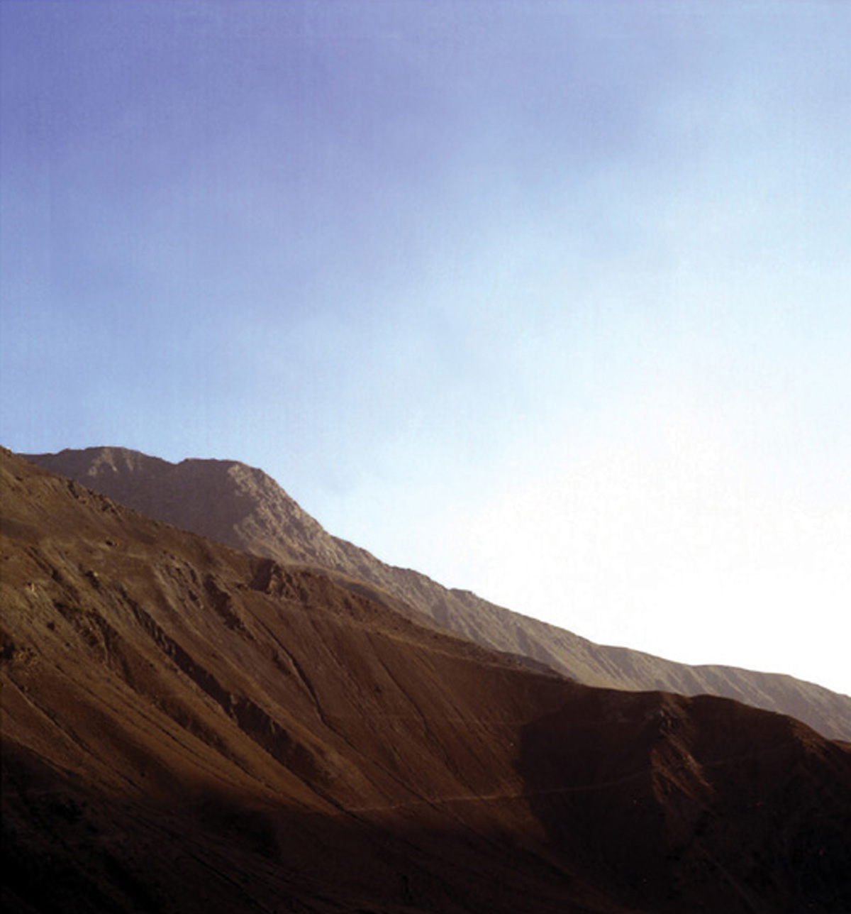 A photograph by artist Marine Hugonnier titled “Mountain with No Name (Pandjshêr Valley, Afghanistan)”, two thousand three.
