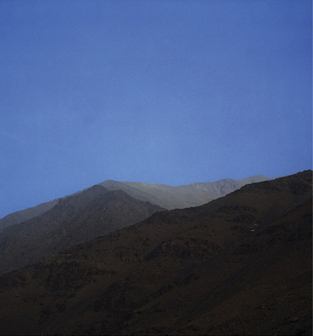 A photograph by artist Marine Hugonnier titled “Mountain with No Name (Pandjshêr Valley, Afghanistan)”, two thousand three.