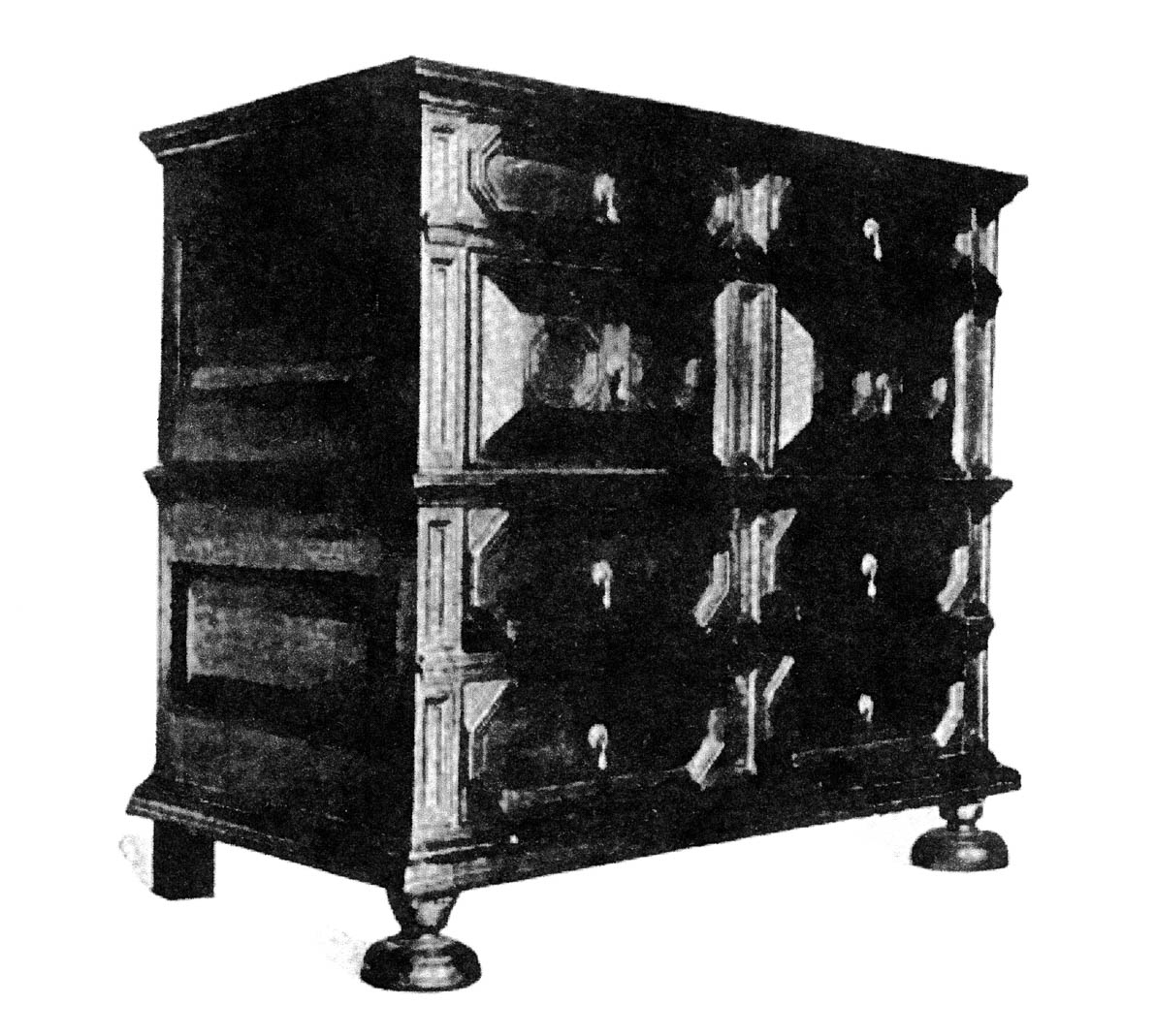 An illustration of a paneled chest of drawers with flat onion turned feet, sixteen seventy five seventeen hundred from Luke Vincent Lockwood’s nineteen twenty six book, “Colonial Furniture in America.”