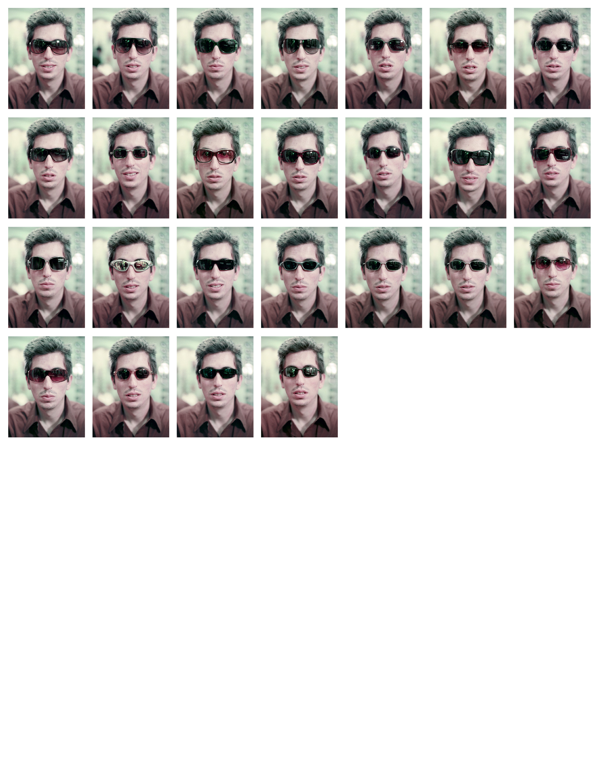 Twenty five small photographs, arranged in a grid, of artist San Keller wearing different sunglasses.