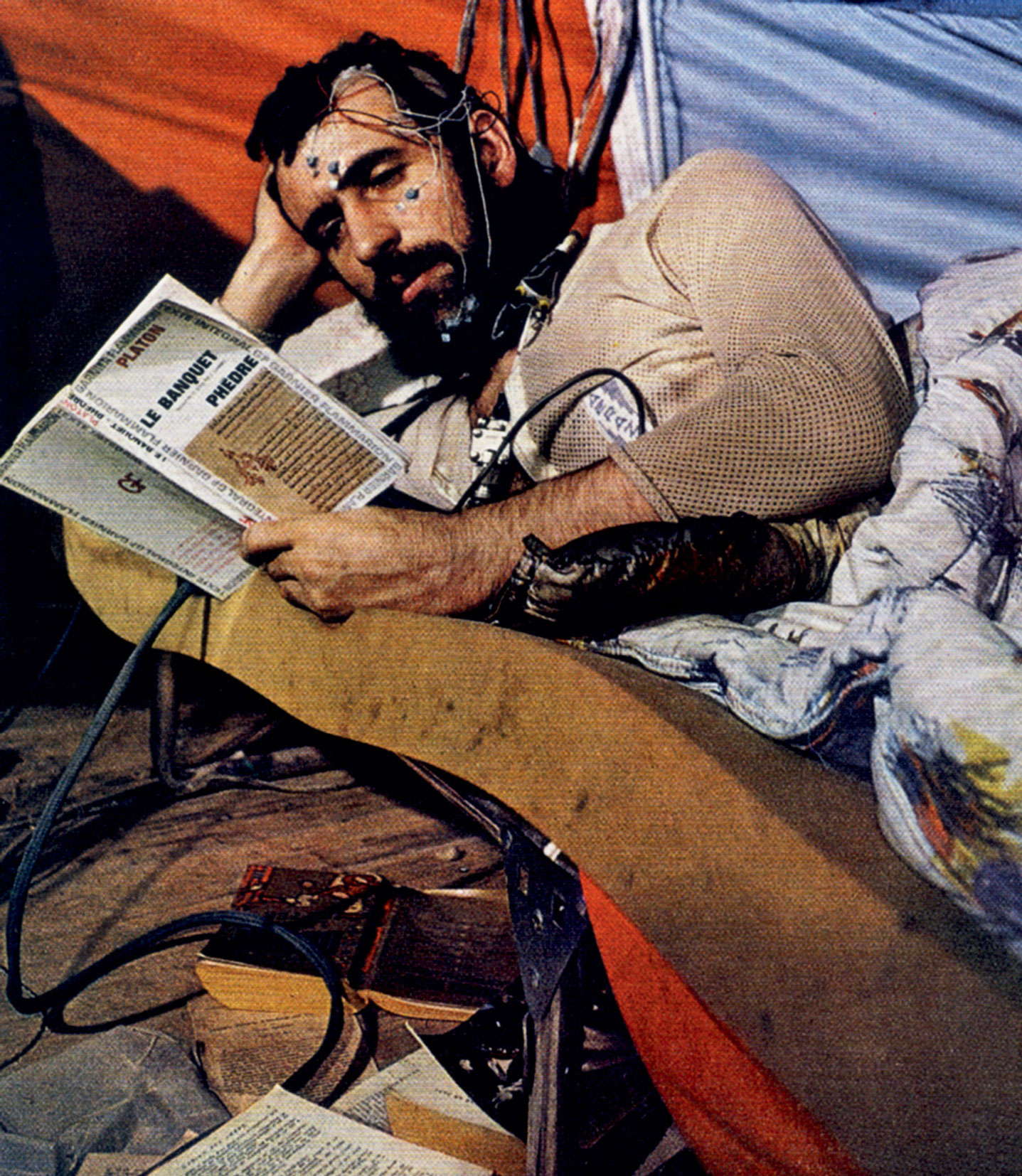 A photograph of Siffre reading Plato in the cave.