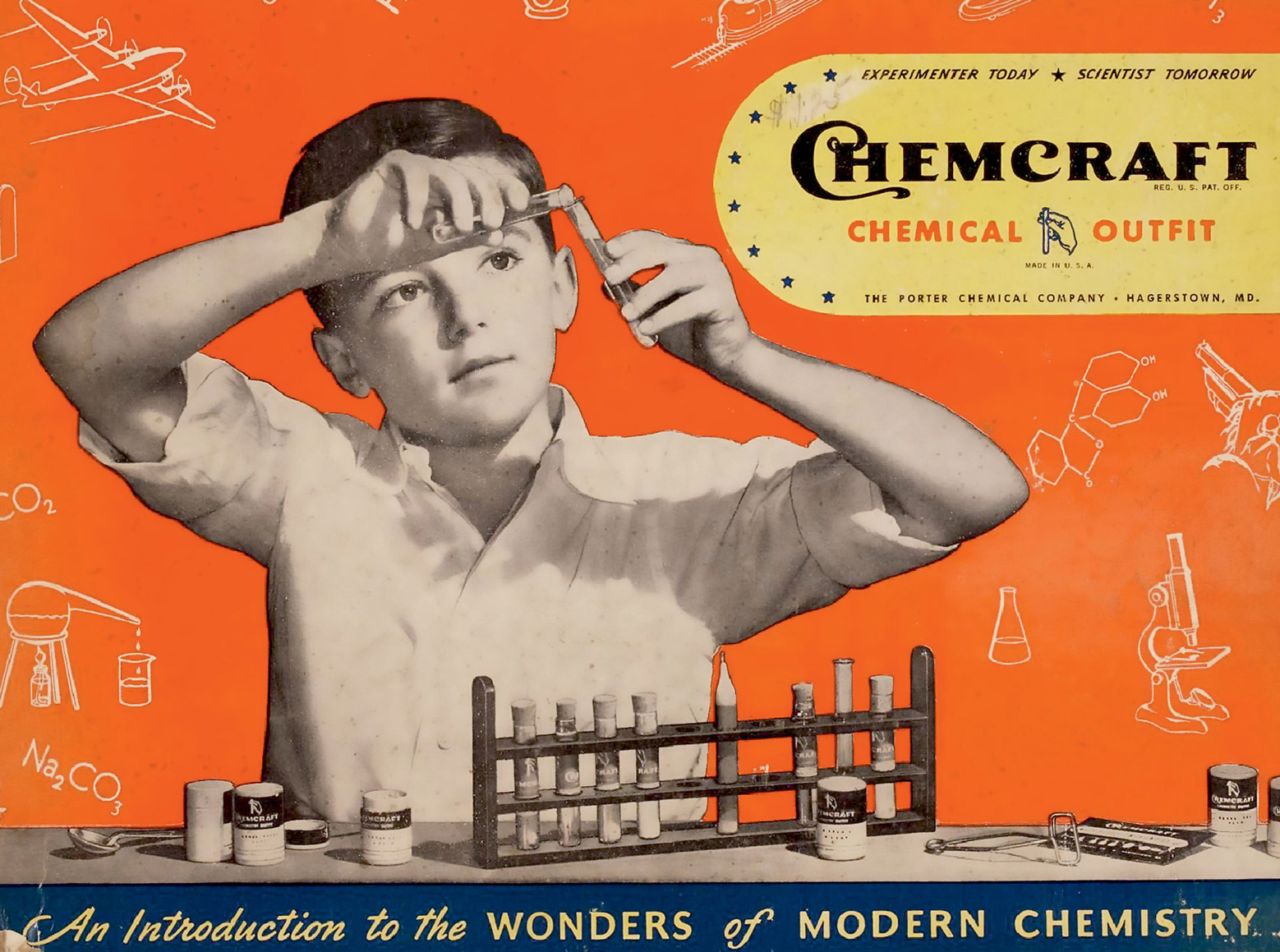The front of Porter Chemical Company's 1947 chemistry kit which shows a young boy conducting an experiment. 