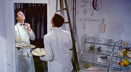 A still from Jacques Tati's 1967 film Playtime which shows plaice being served. 