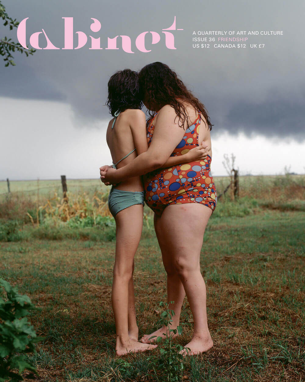 Artist Alessandra Sanguinetti’s photograph The Black Cloud from the year 2000. It depicts two young girls hugging one another while gazing out over a field.