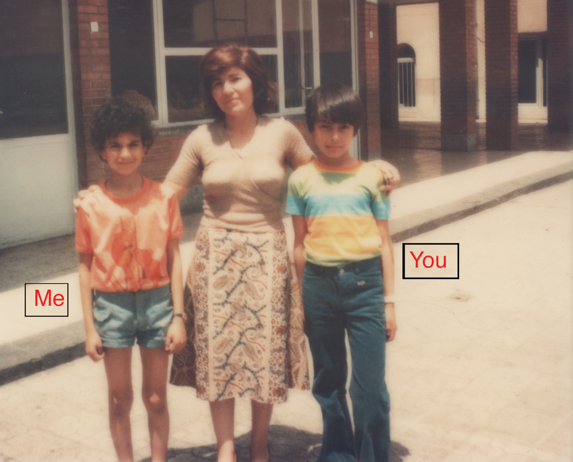 A photograph of two children labeled “ME” and “YOU.”