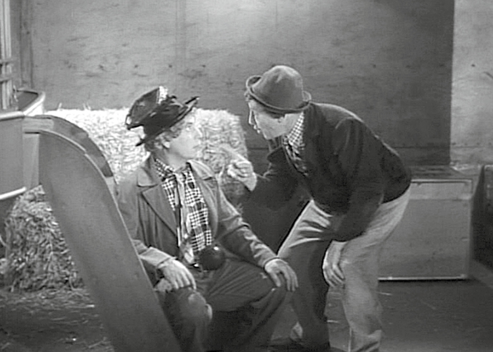 A still from the nineteen thirty nine film “At The Circus” depicting Harpo Marx with his horn tucked into his pants.