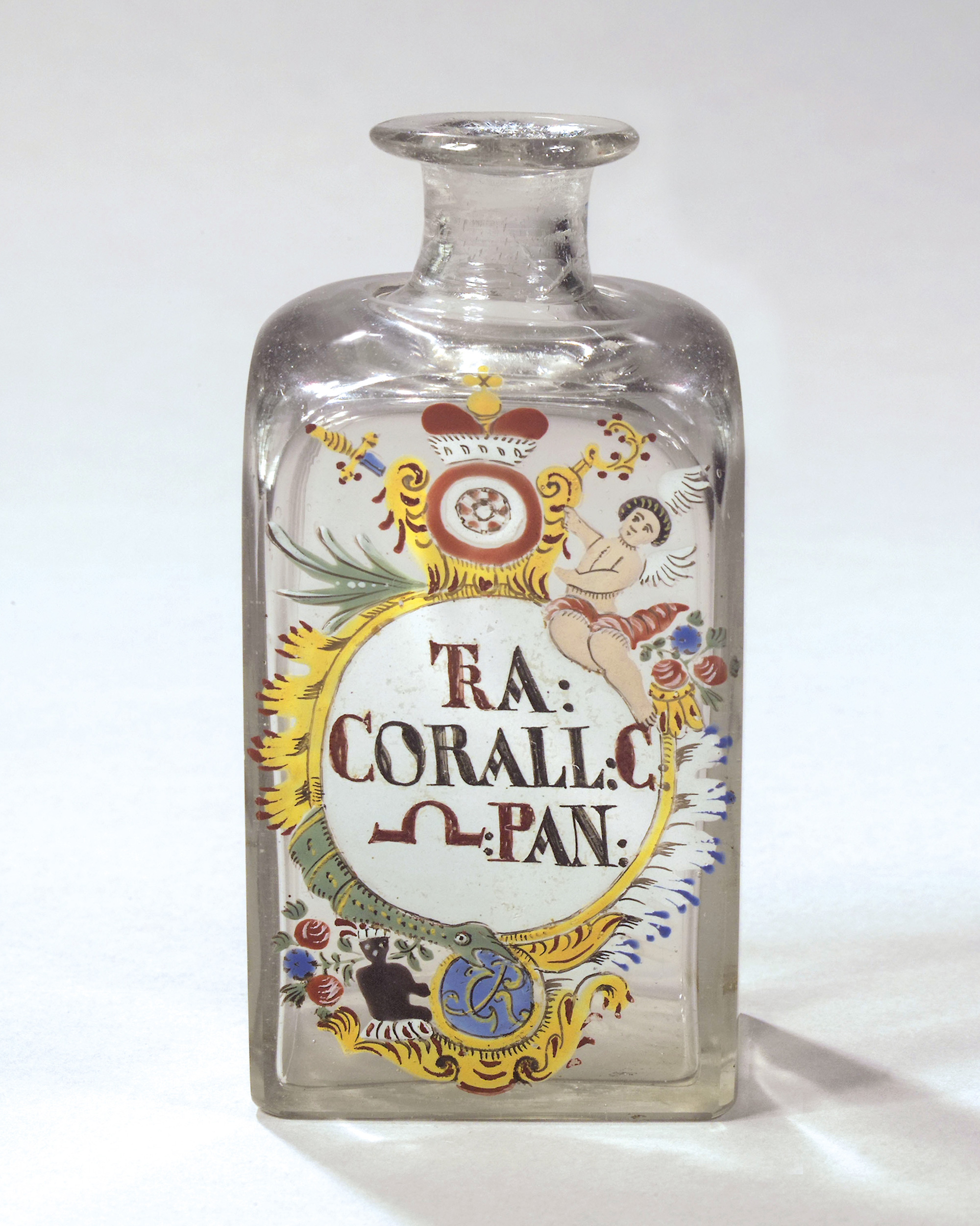 A photograph of a mid-eighteenth-century pharmaceutical flask to hold tincture incorporating spiritus panis. The word spiritus has been replaced on the flask by its alchemical symbol.