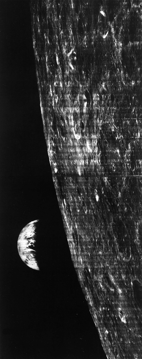 The first ever photograph of an “earthrise” (25 August 1966, Lunar Orbiter I). When published by the New York Times the next day, the newspaper remarked, “Horizontal orientation lines were added to the picture after it was received by a tracking station near Madrid.”
