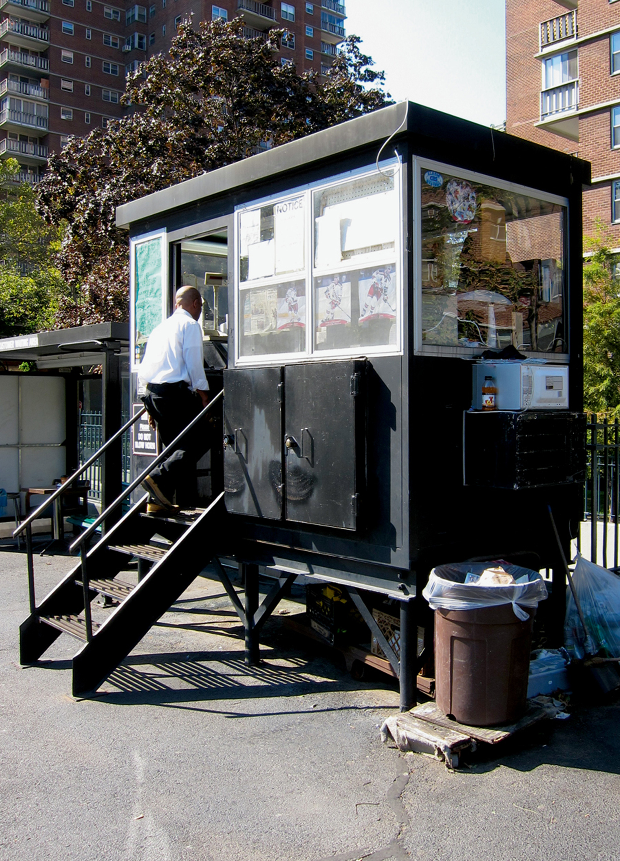 A photograph of a valet booth on twenty-sixth Street, between eighth and ninth Avenues, in New York City.