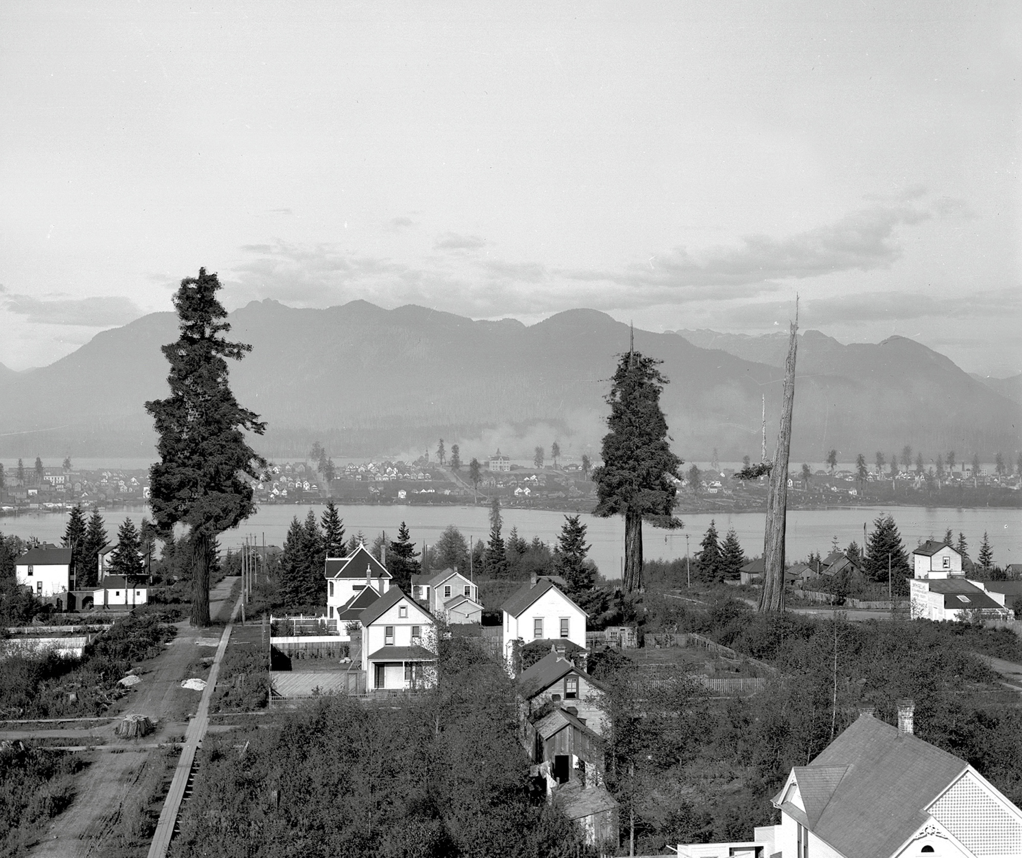 A photograph titled “Roundabout Vancouver: Mount Pleasant, circa nineteen thirties.” It shows a neighborhood in the shadow of Mount Pleasant.